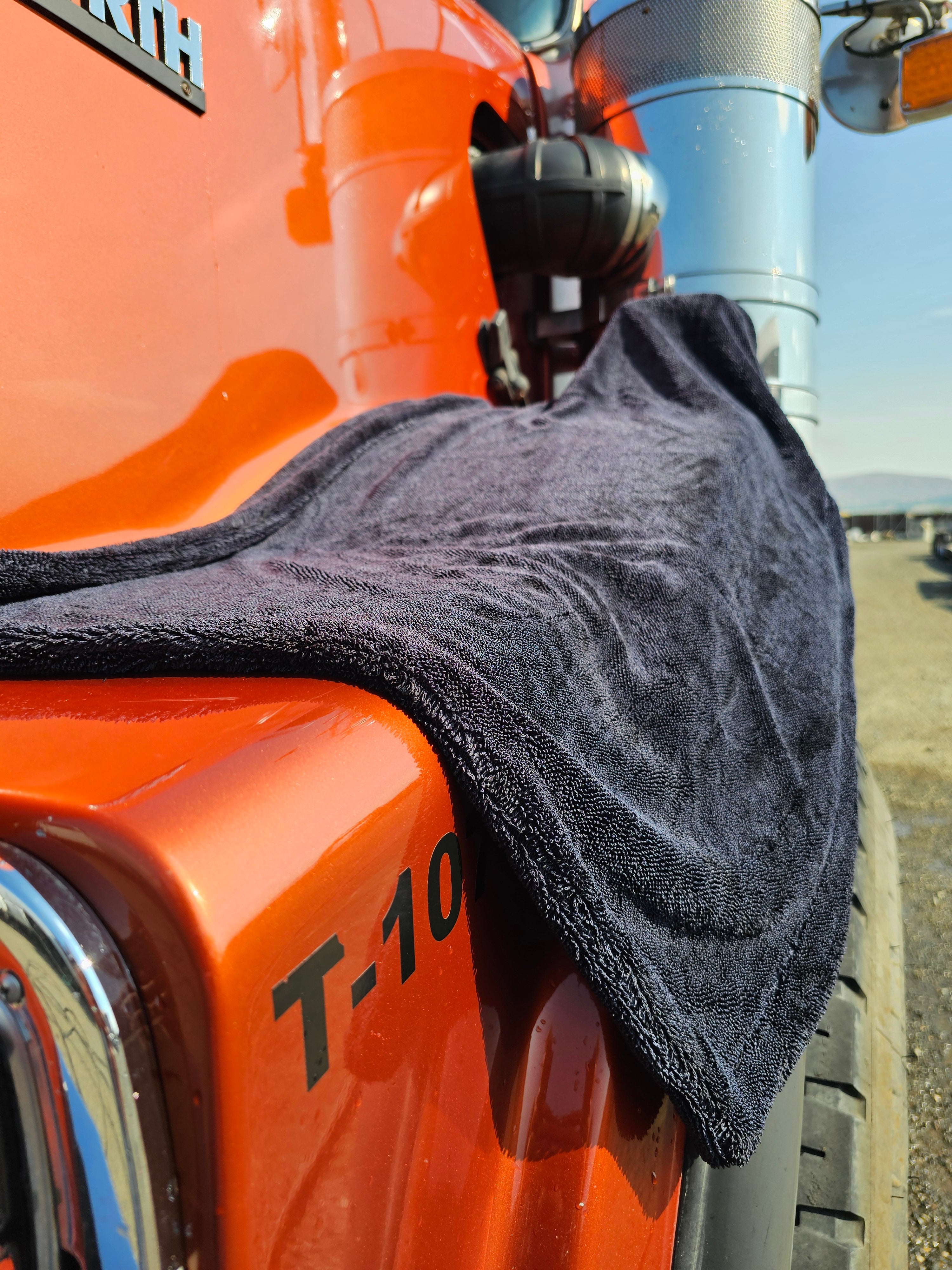 a black cloth on an orange truck